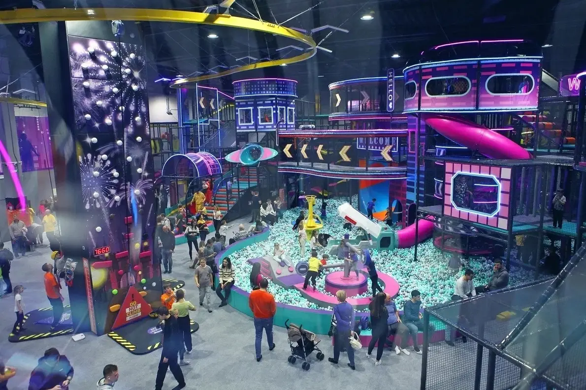 Family amusement park in Kaliningrad NEOPORT, a view of labyrinths, slides in the form of a dinosaur or a snake, balls in the city of the future.