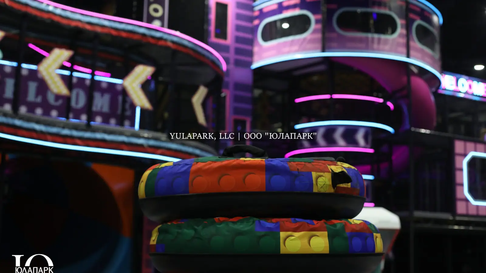 A children's playroom with a glowing skyrider, where a child flies over a park in the style of the city of the future and with a lot of lighting.