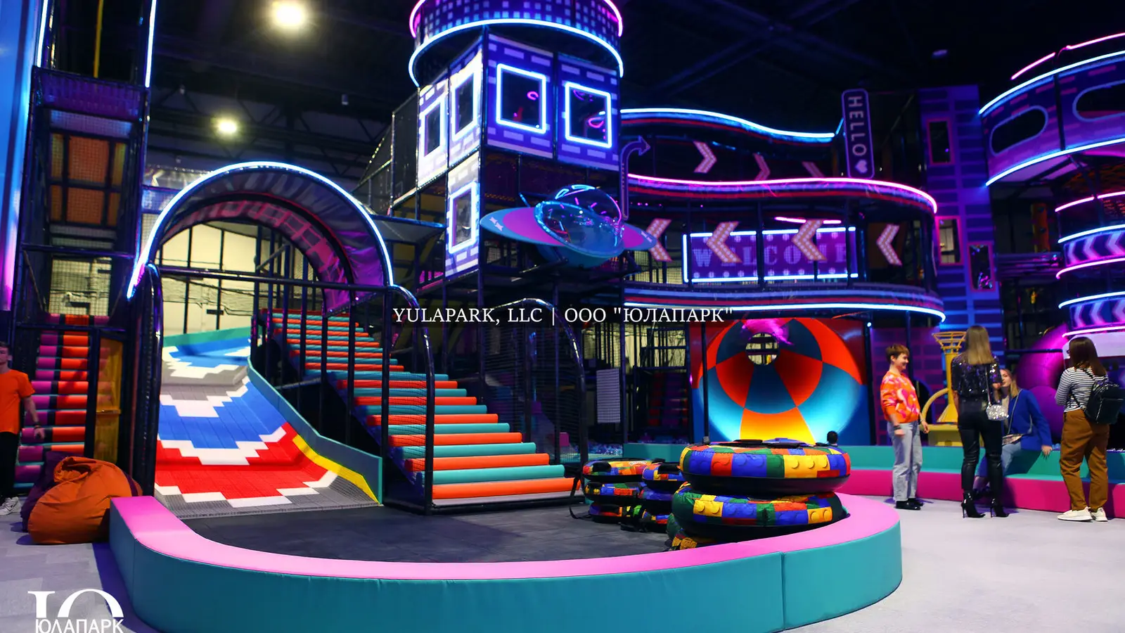 A family amusement park in Kaliningrad NEOPORT, a view of the labyrinths, a bridge, pools with balls and colorful tubing for children in the city of the future.