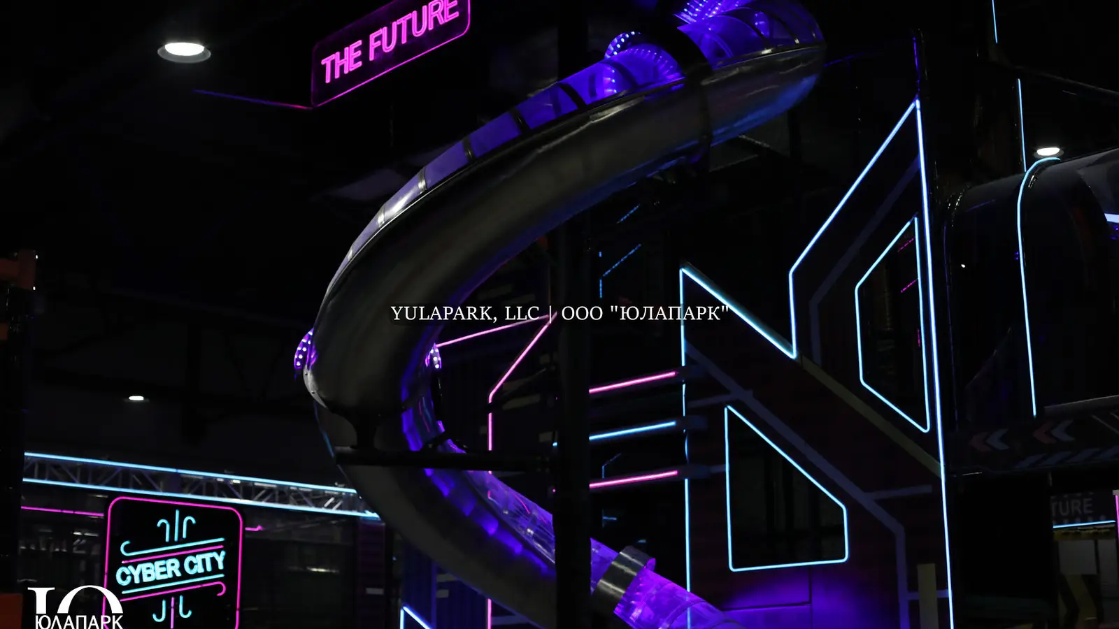 Children's amusement park, children's playroom with a restaurant in Kaliningrad. A steel slide with lighting in the city of the future.